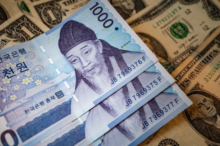 South Korean Won notes. The Korean Won is grappling with several economic and political challenges impacting its value. Economically, South Korea is facing inflationary pressures, driven by global supply chain disruptions and rising energy costs, which are affecting consumer prices and overall economic stability. The Bank of Korea has been adjusting interest rates to manage inflation, but these measures are also influencing economic growth and currency stability. Politically, tensions with North Korea and uncertainties in global trade, particularly with key partners like China and the United States, add to the volatility of the Won. Additionally, shifts in global investor sentiment and capital flows due to geopolitical events and monetary policy changes in major economies further impact the Won's exchange rate. These factors collectively shape the outlook for the Korean Won and the country's economic health.