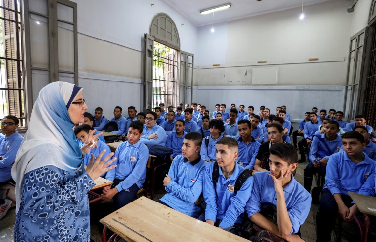 An Egyptian teacher instructs students on the first day of the academic year at Al Sadeeya school, in Cairo, Egypt October 1, 2023. REUTERS/Mohamed Abd El Ghany