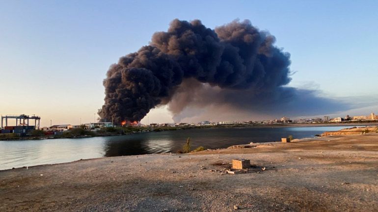 A view shows a large plume of smoke rising from fuel depot in Port Sudan, Sudan, May 6, 2025. REUTERS/Khalid Abdelaziz